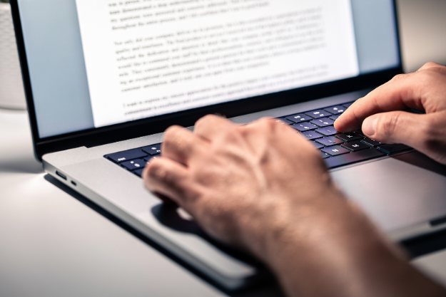 Typing Blog on Laptop